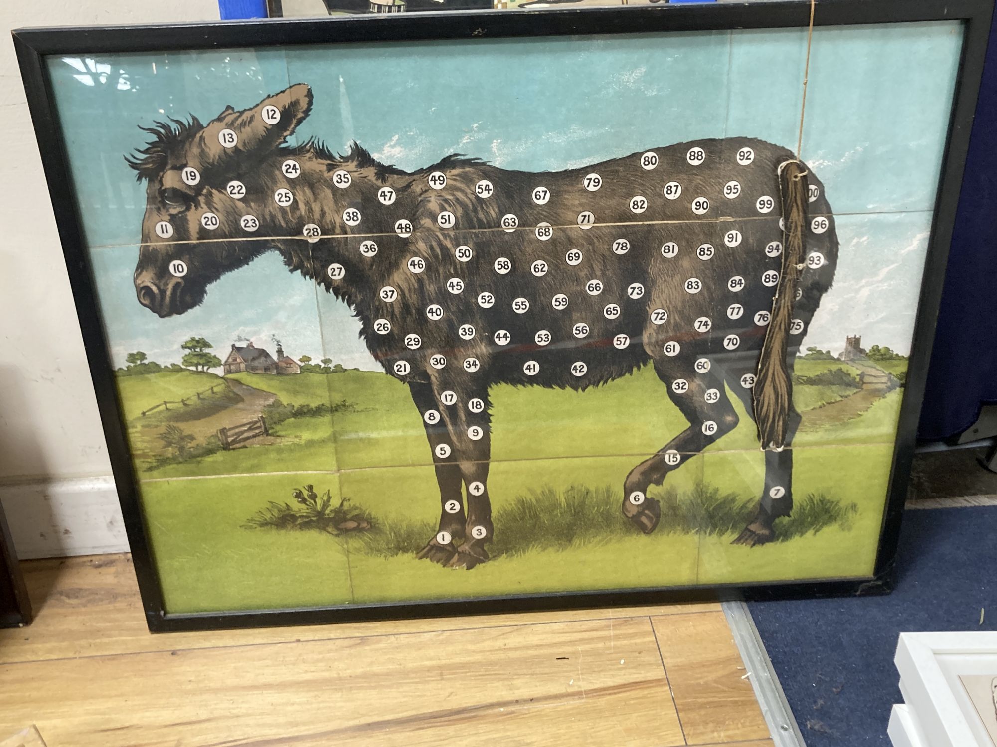 A group of Victorian and later chromolithographs and colour prints, including The tail-less donkey, 54 x 72cm and two jig-saw puzzles